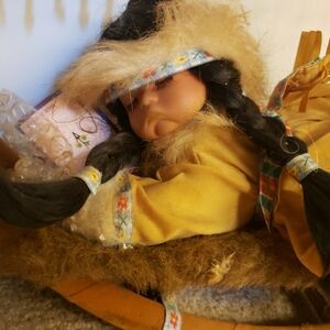 porcelain native American baby doll in a cradle "Emily"